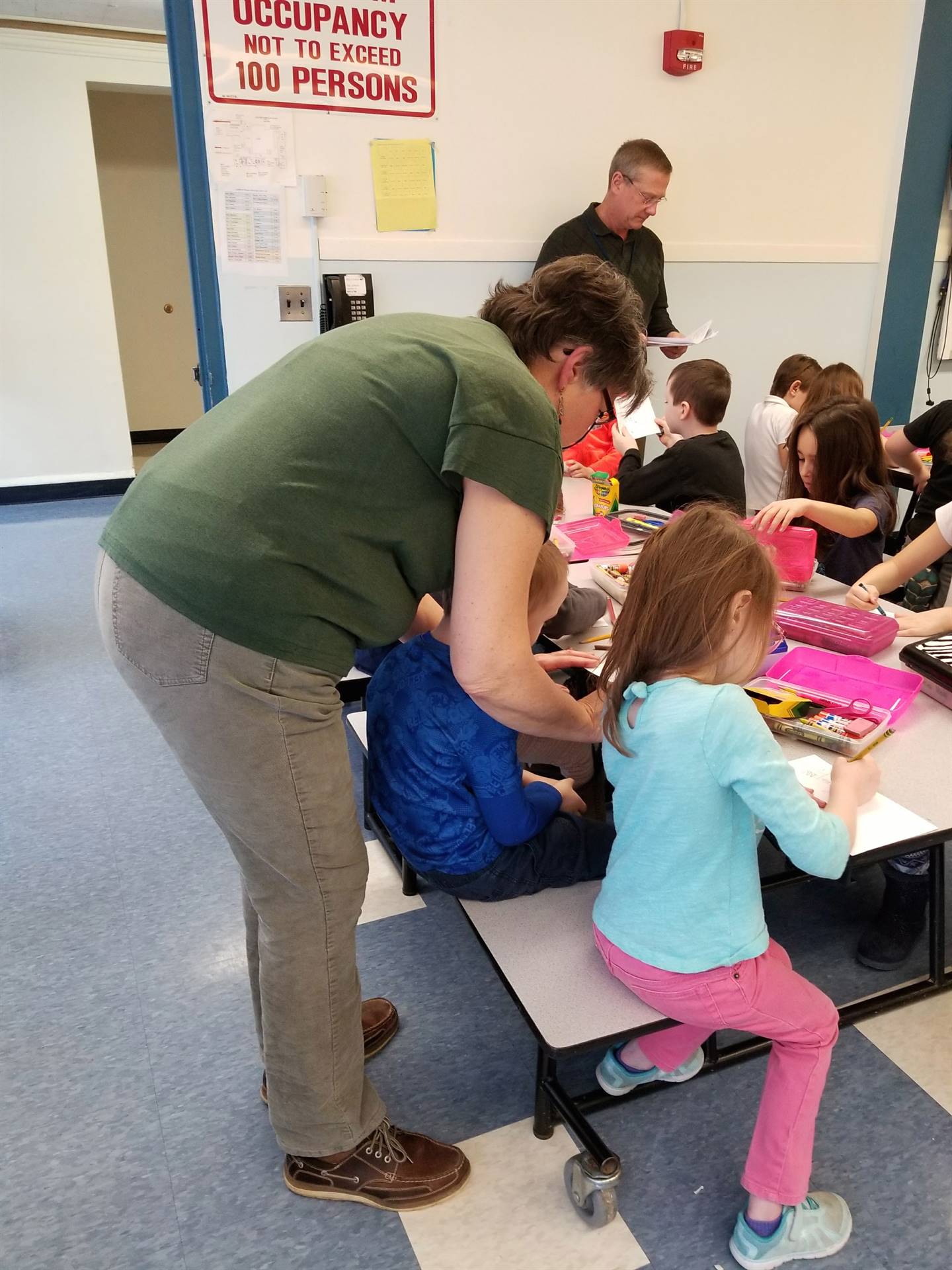 Mrs. Butcher helps students with Ag. Day.