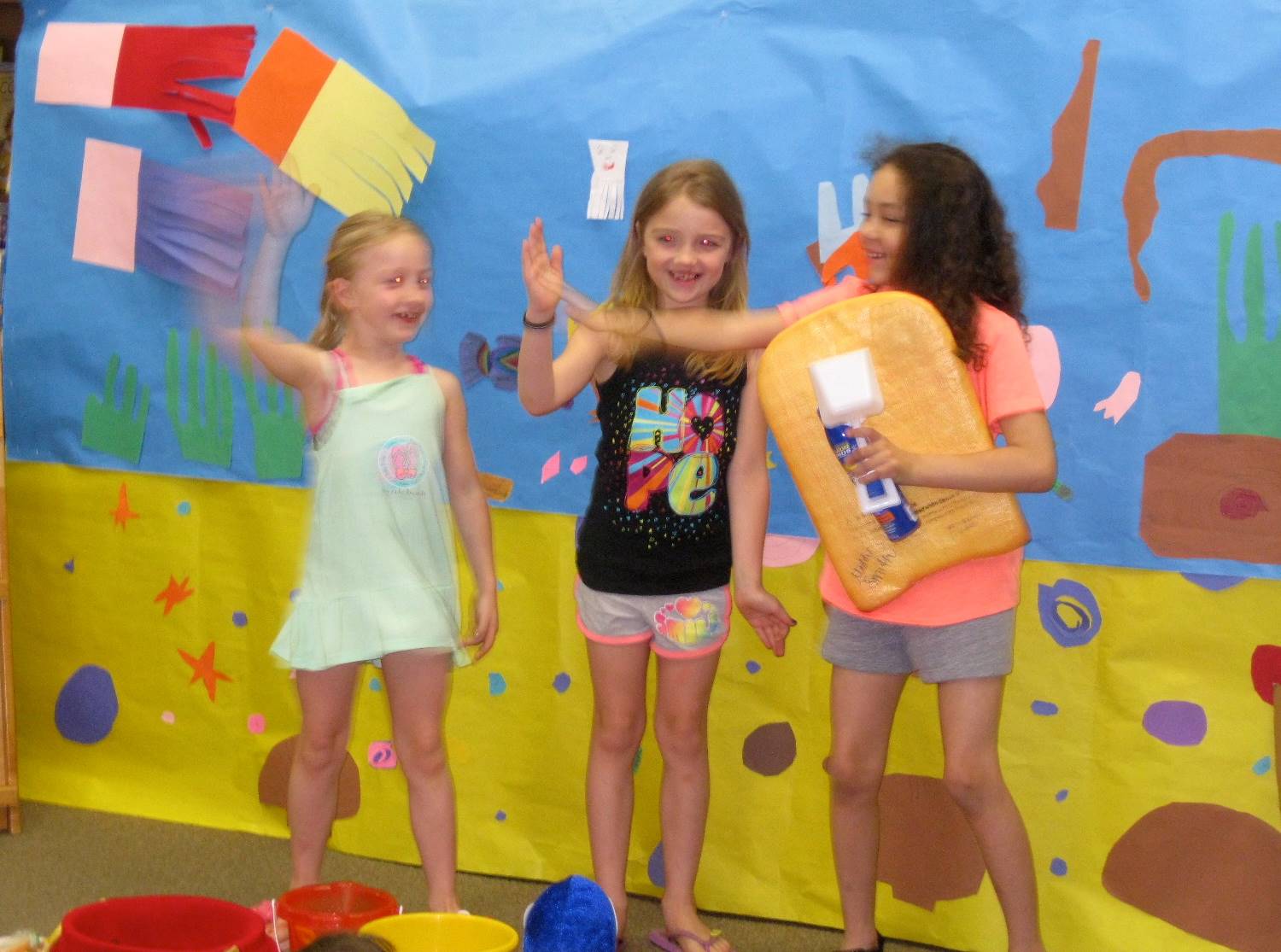 first grade students deliver a play.