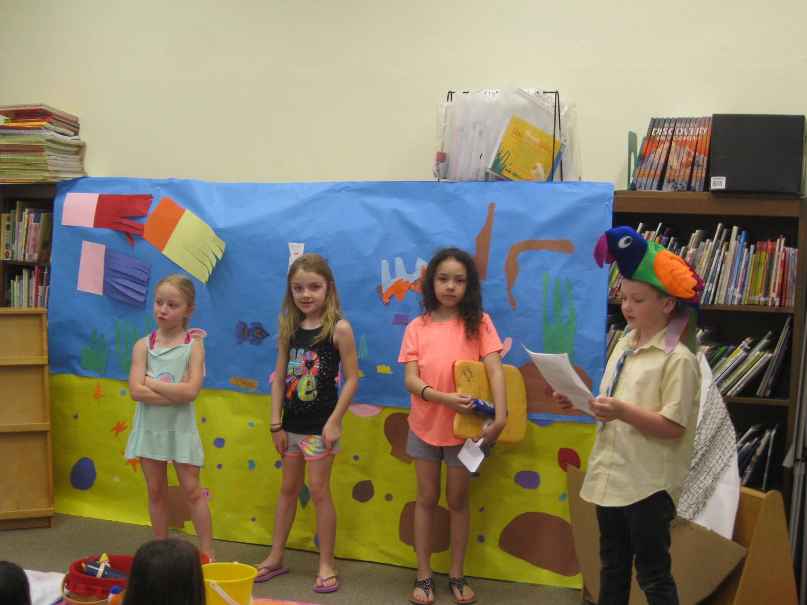 first grade students deliver a play.