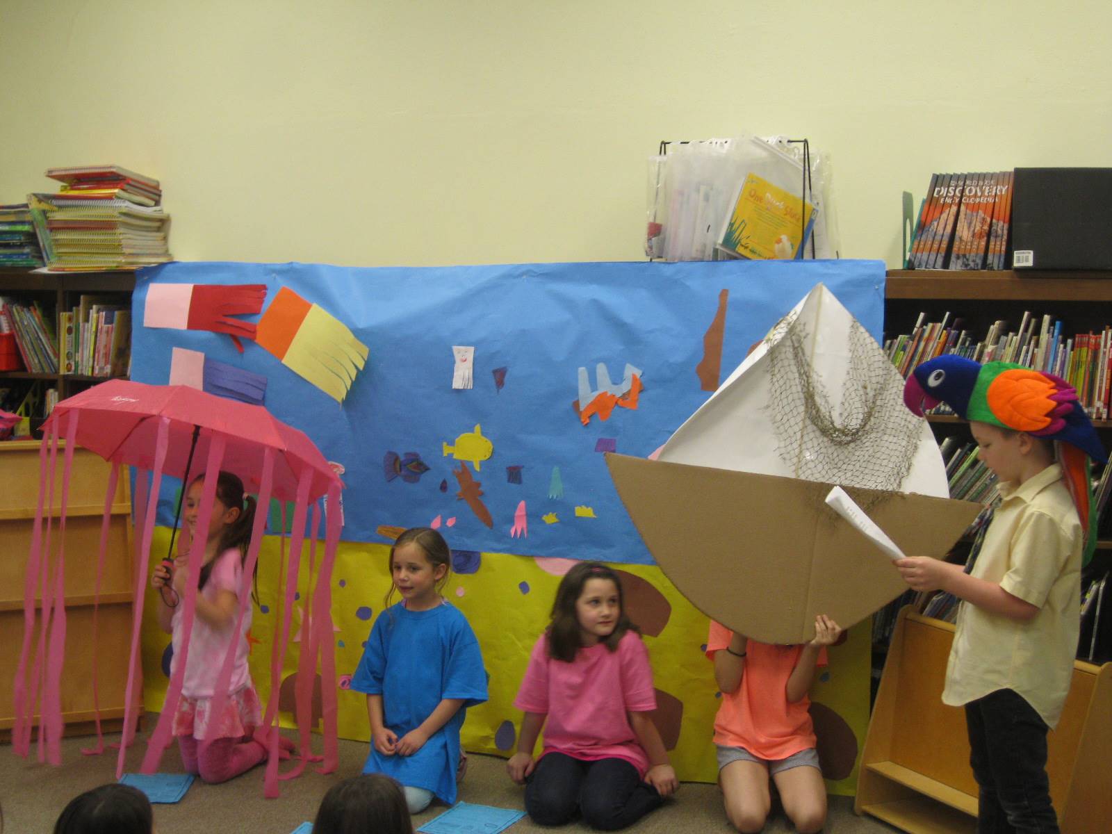 first grade students deliver a play.