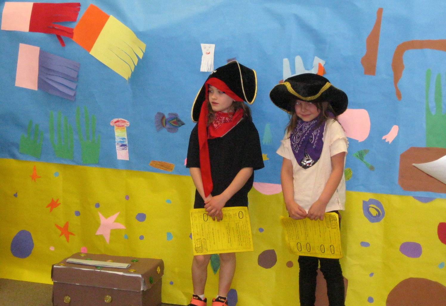 Two first graders dressed up as pirates as a play.