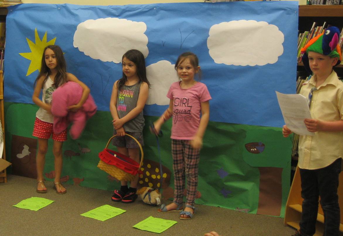 first grade students deliver a play about a picnic.