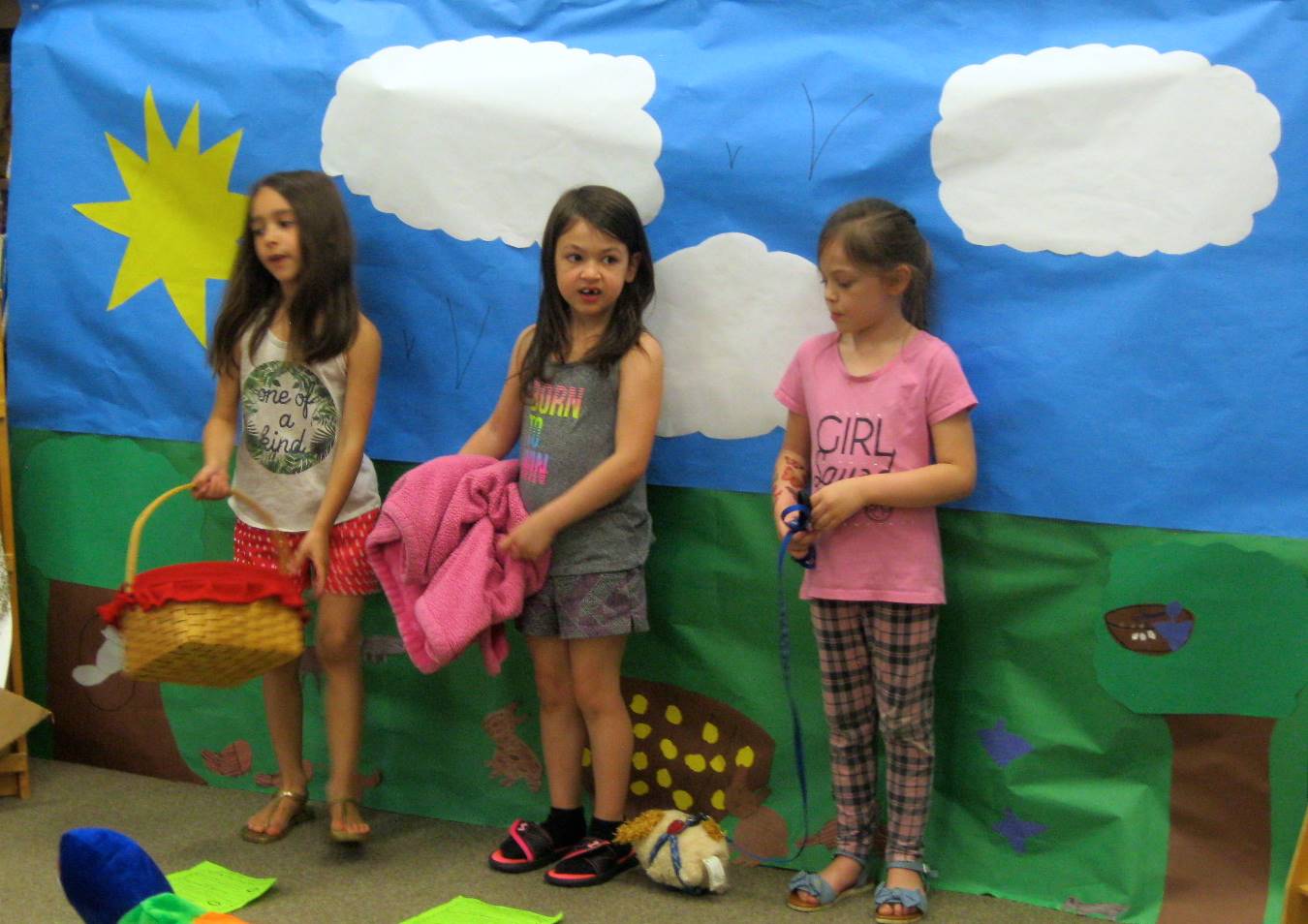 first grade students deliver a play.