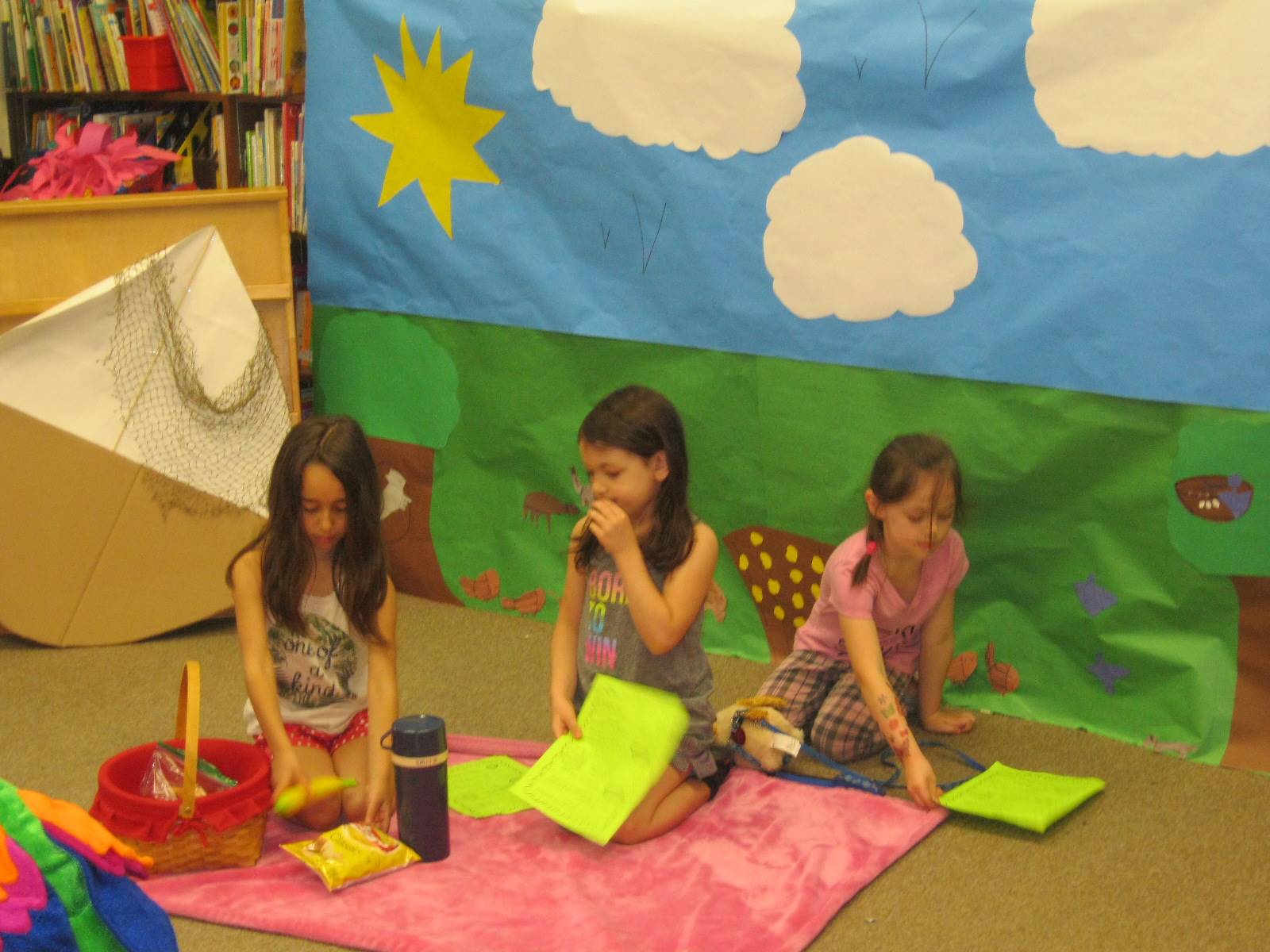 first grade students deliver a play about a picnic.