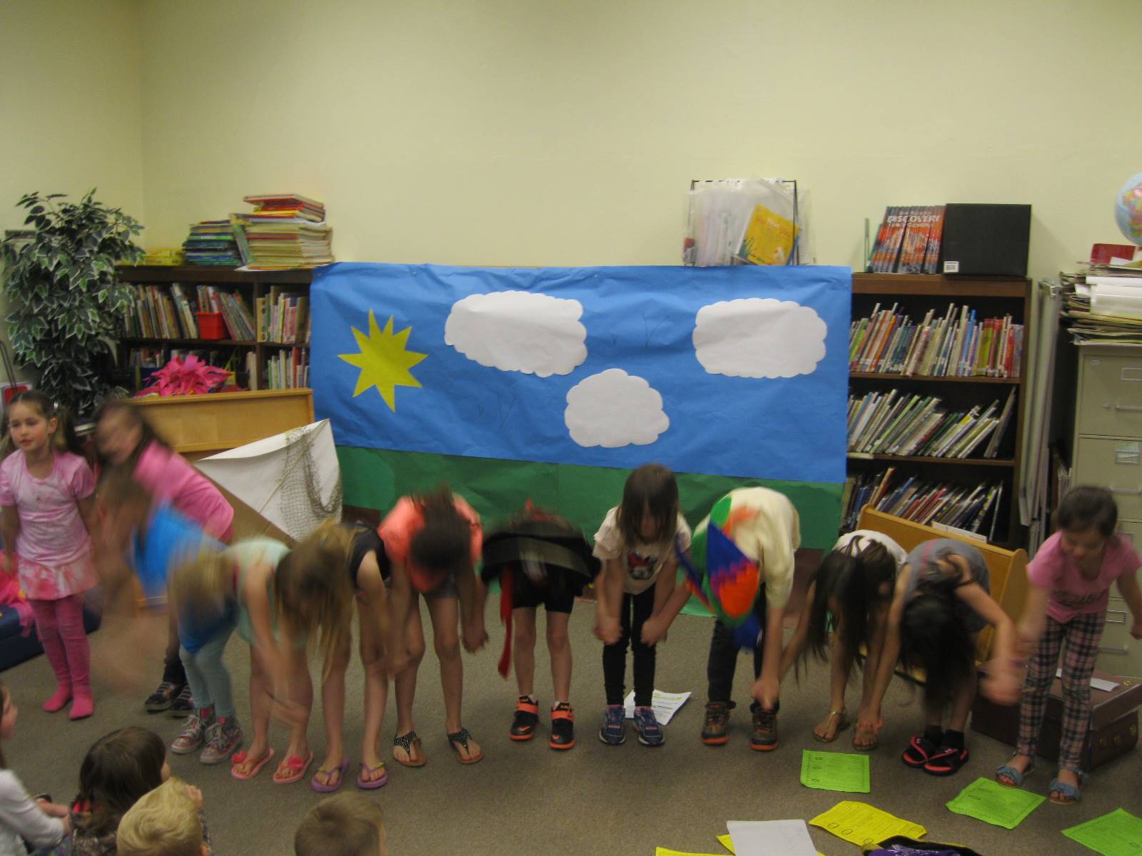 first graders bow to their audience after doing a play. 