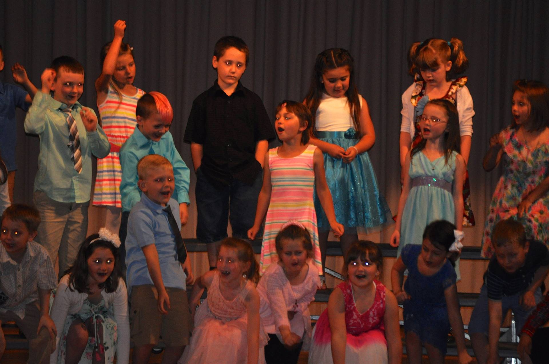 first grade students singing at concert