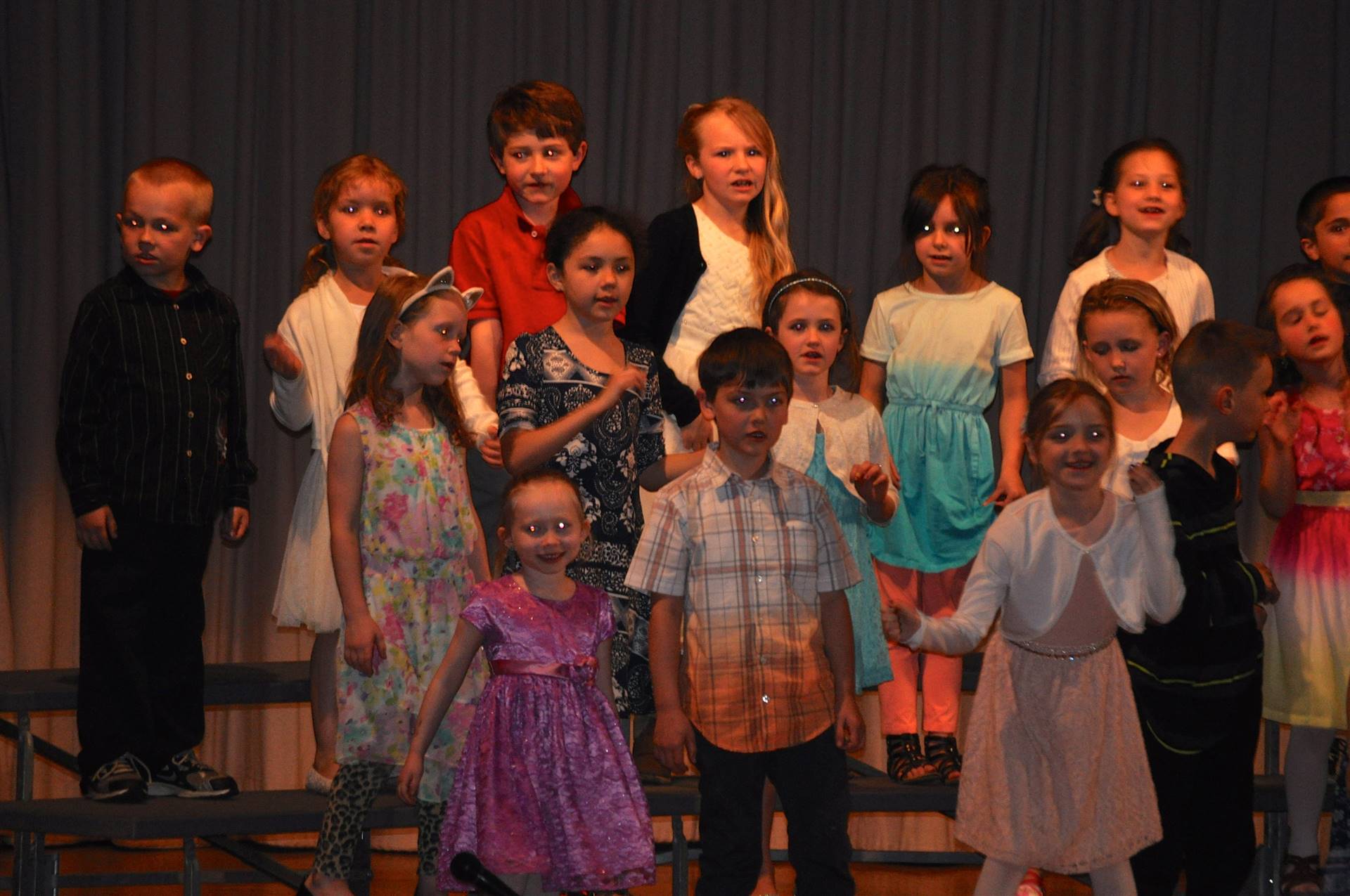 first grade students singing at primary concert