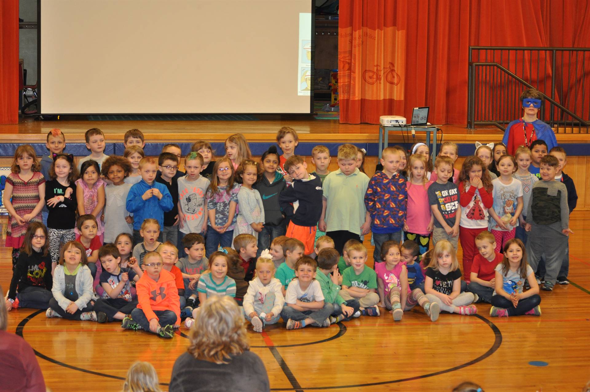 "Super Goal Getter" poses with students who met their personal goals!