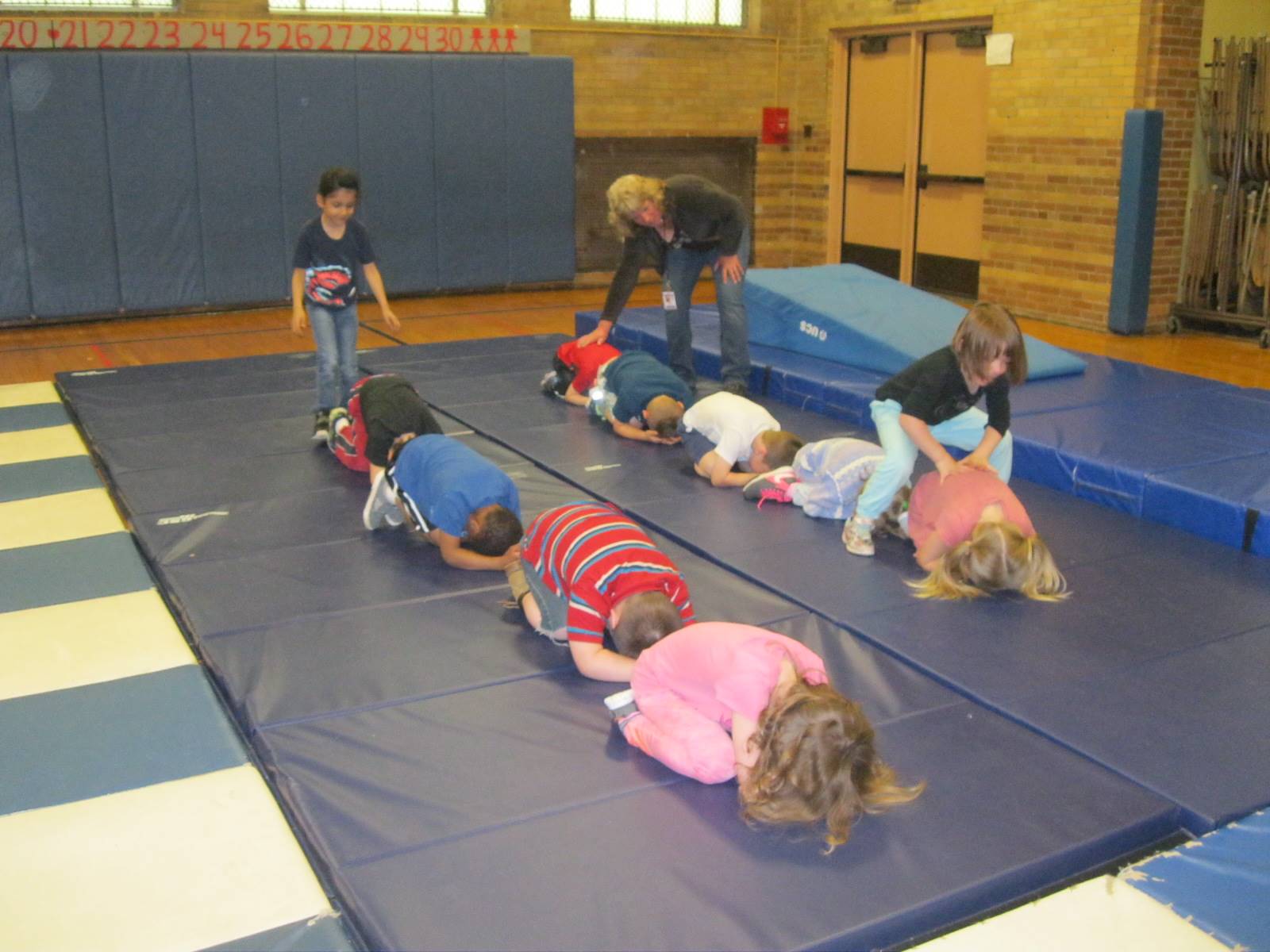 Kindergartners work together playing cooperative games.