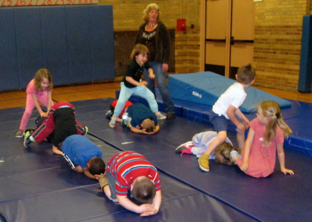 Kindergartners playing cooperative games.