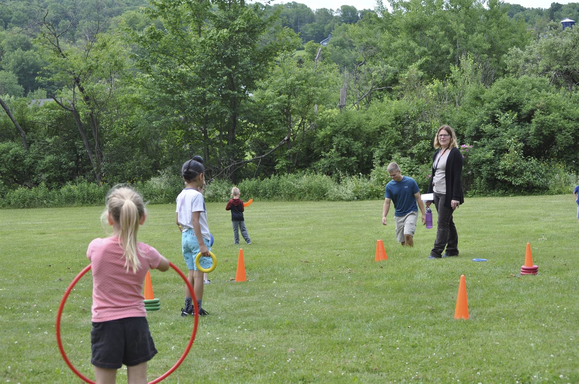 Students play outdoor games at campout.
