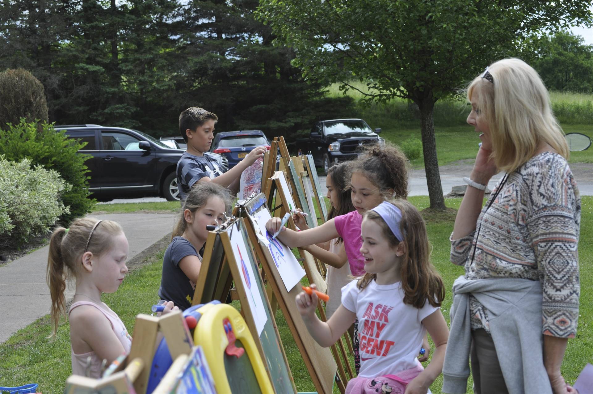 Students paint and draw at the art station.