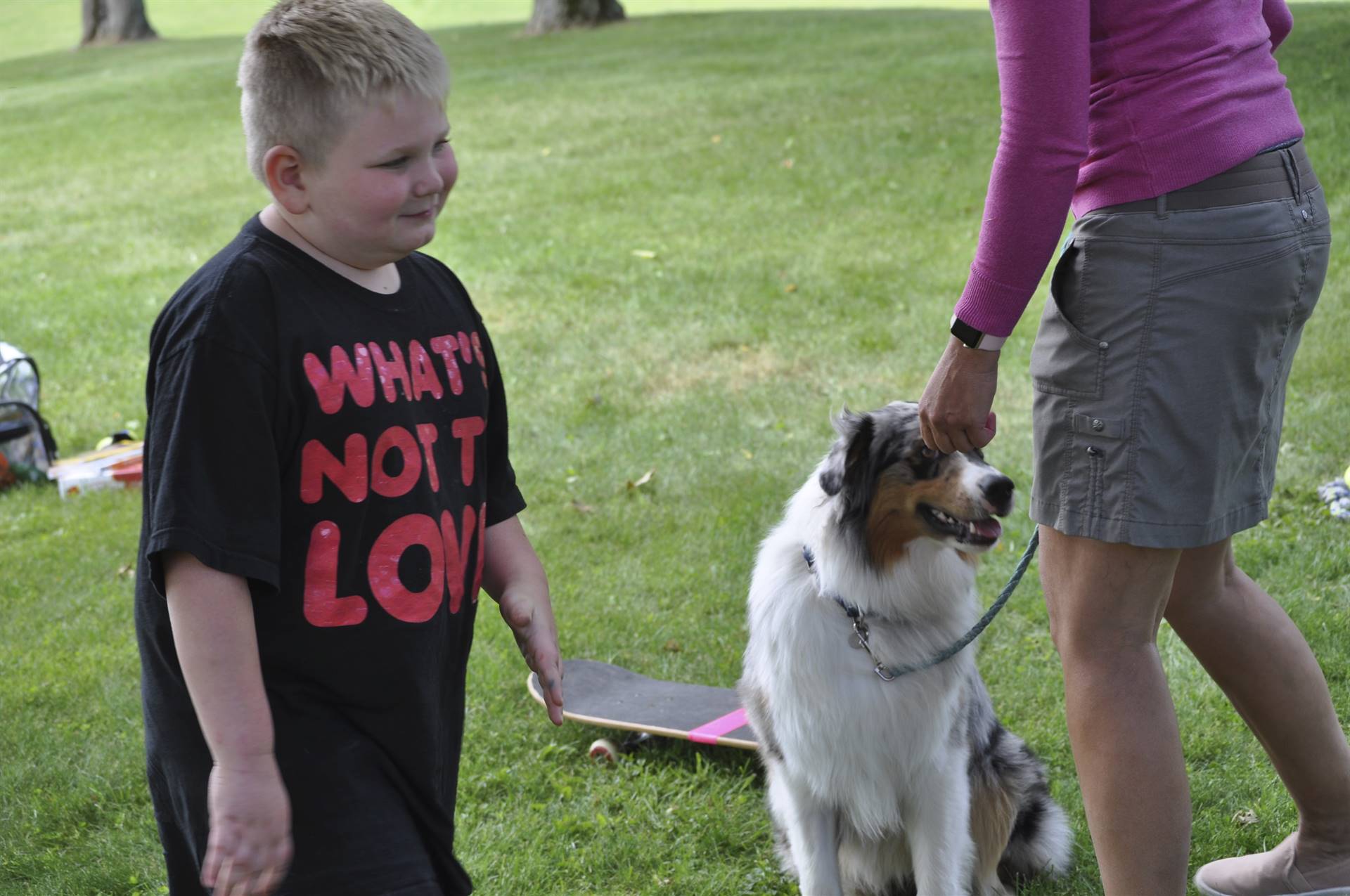 A student gives a therapy dog a treat!