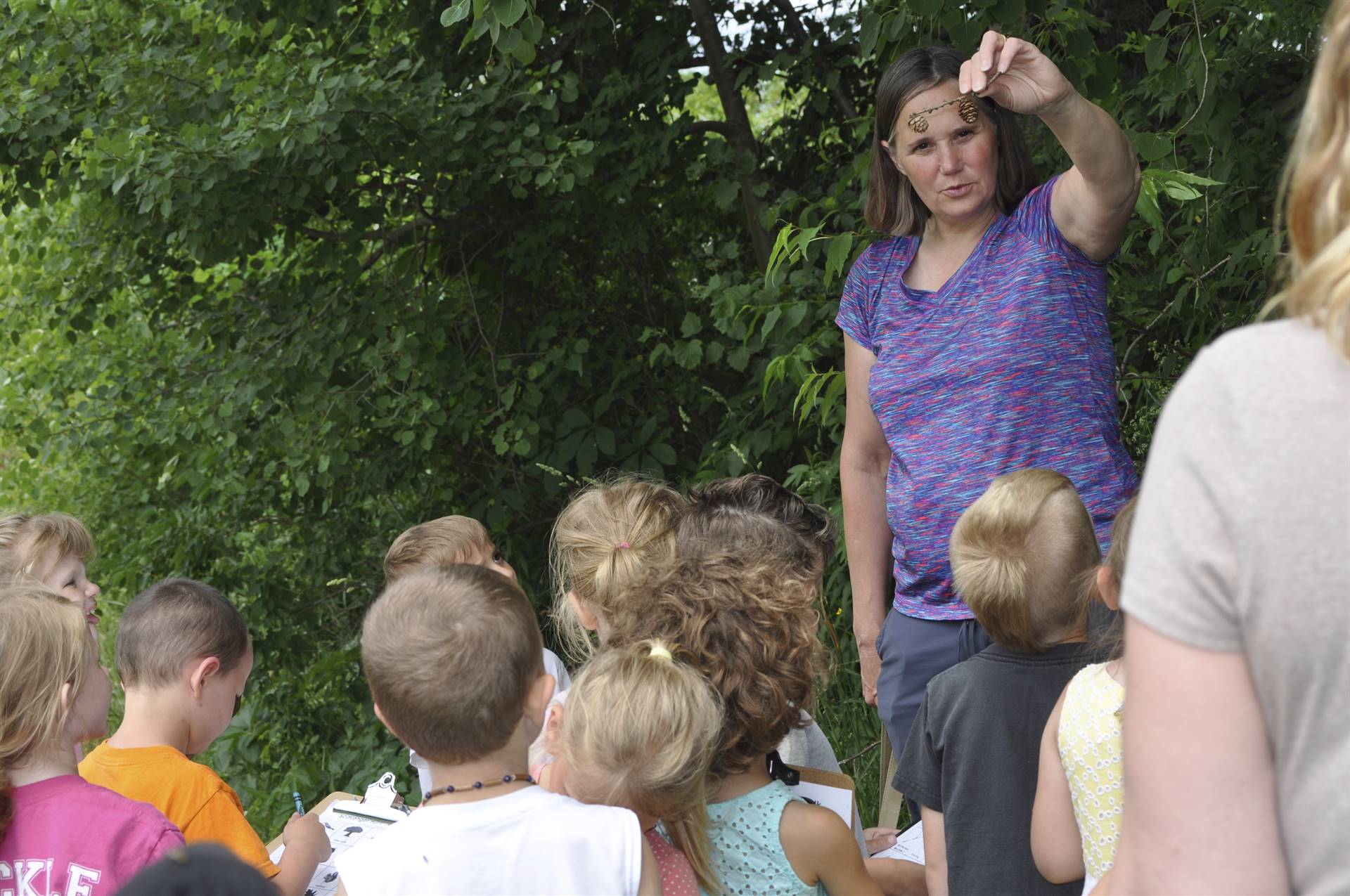 Mrs. Thompson is showing student a miracle of nature on their hike.