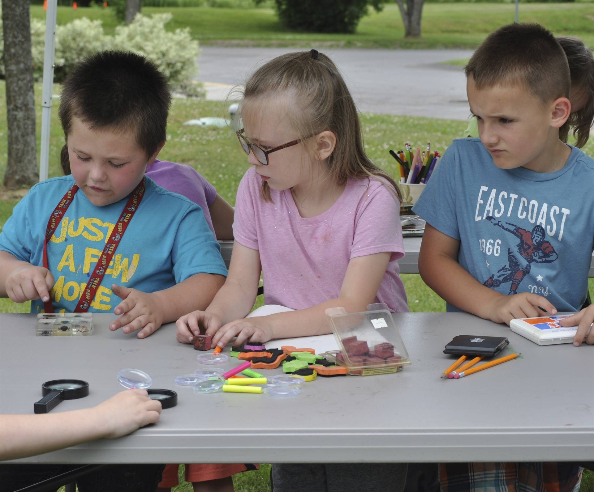 Students create bug stamping art.