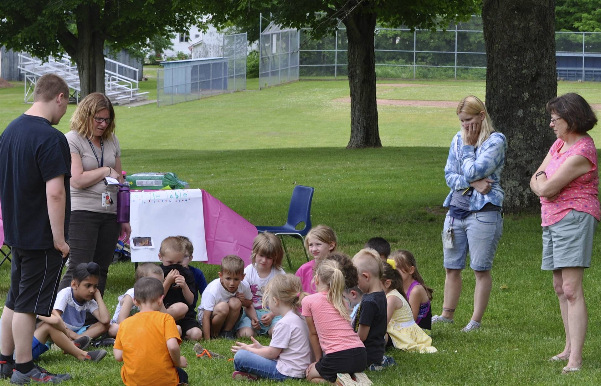 Students watch a lizard at the "creature feature". 