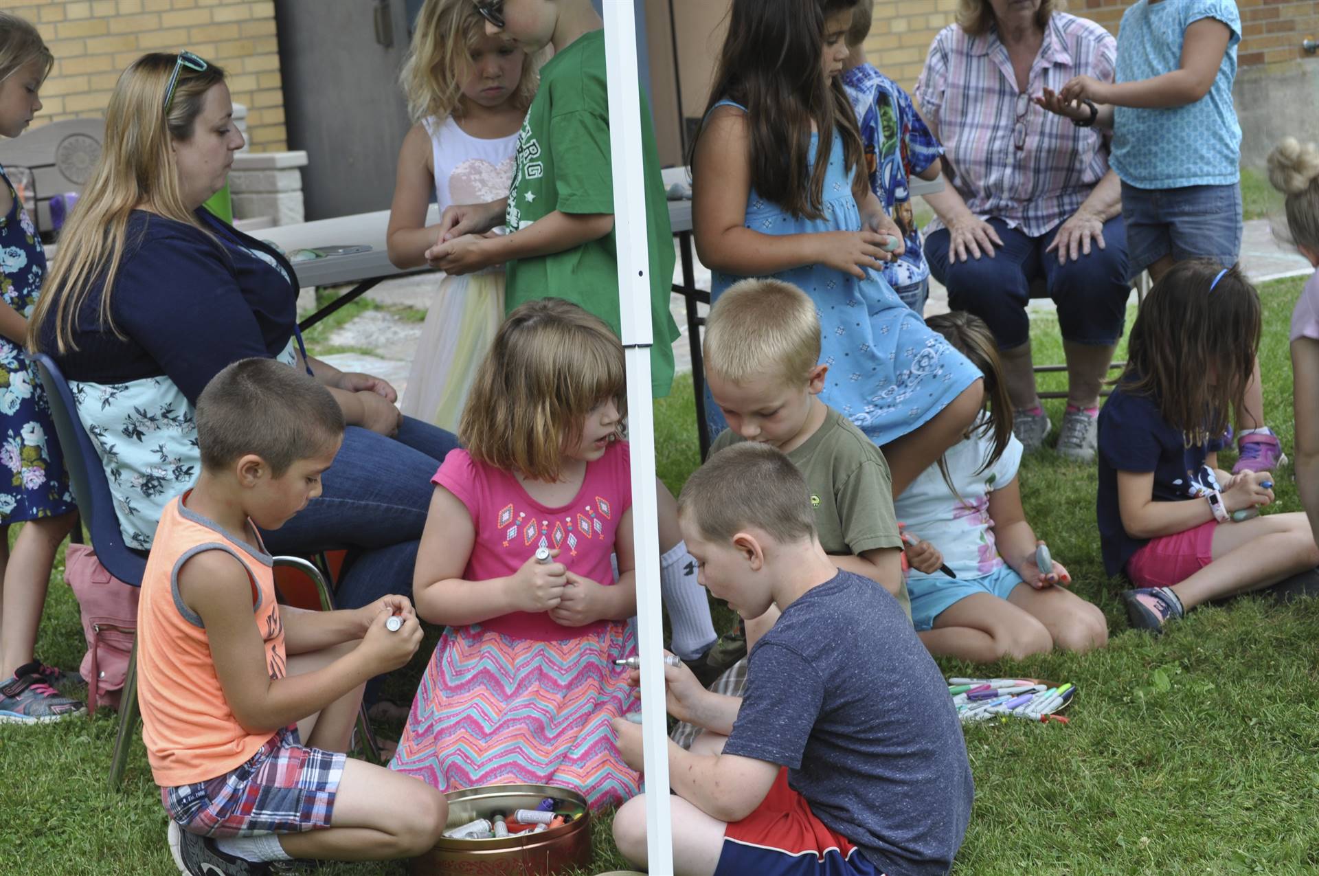 Students paint rocks at the rock station.