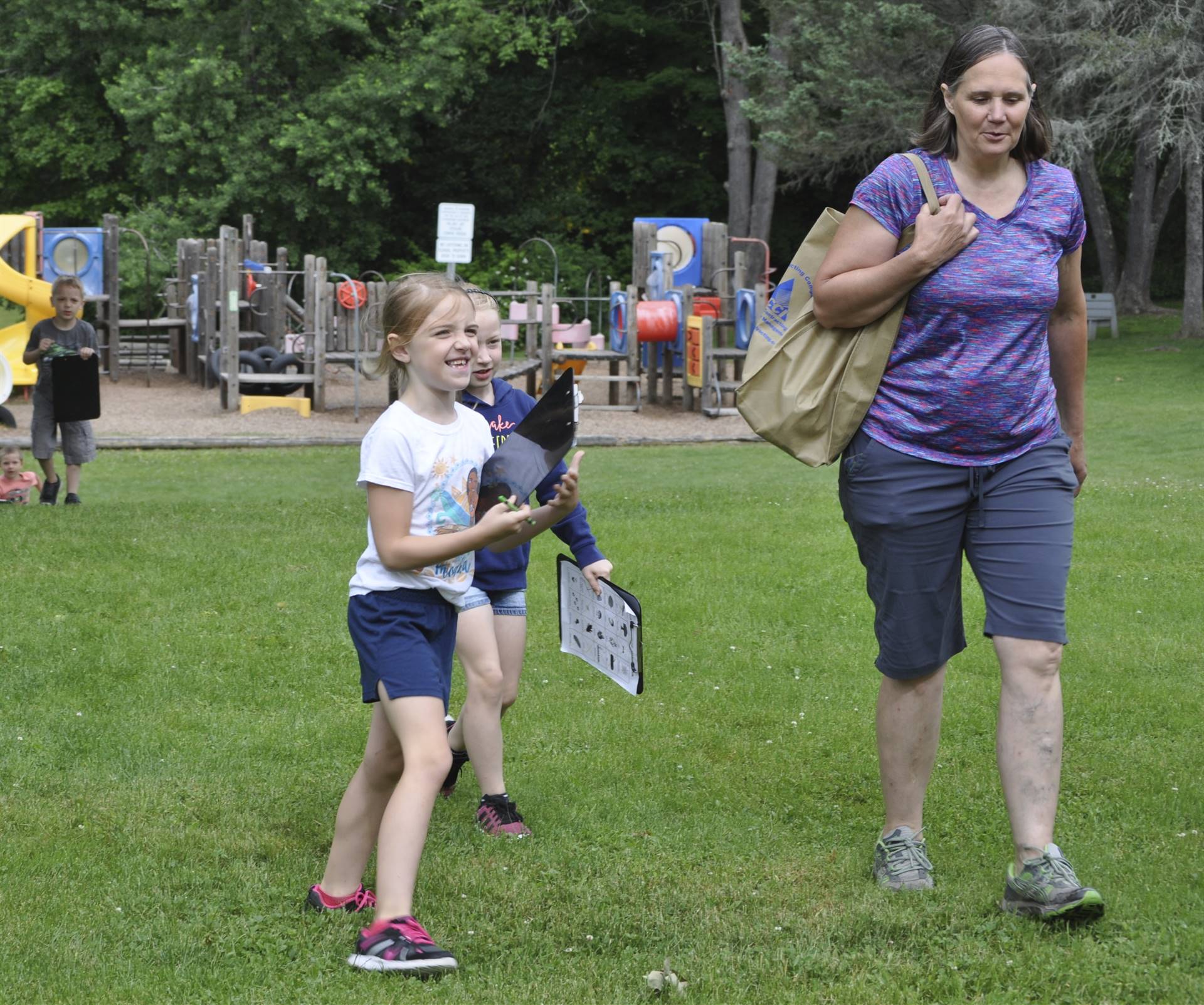 The happy students and Mrs. Thompson hiking at campout day.