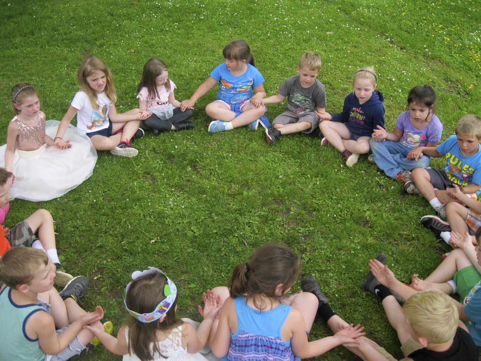 Students play a game around a "campfire".