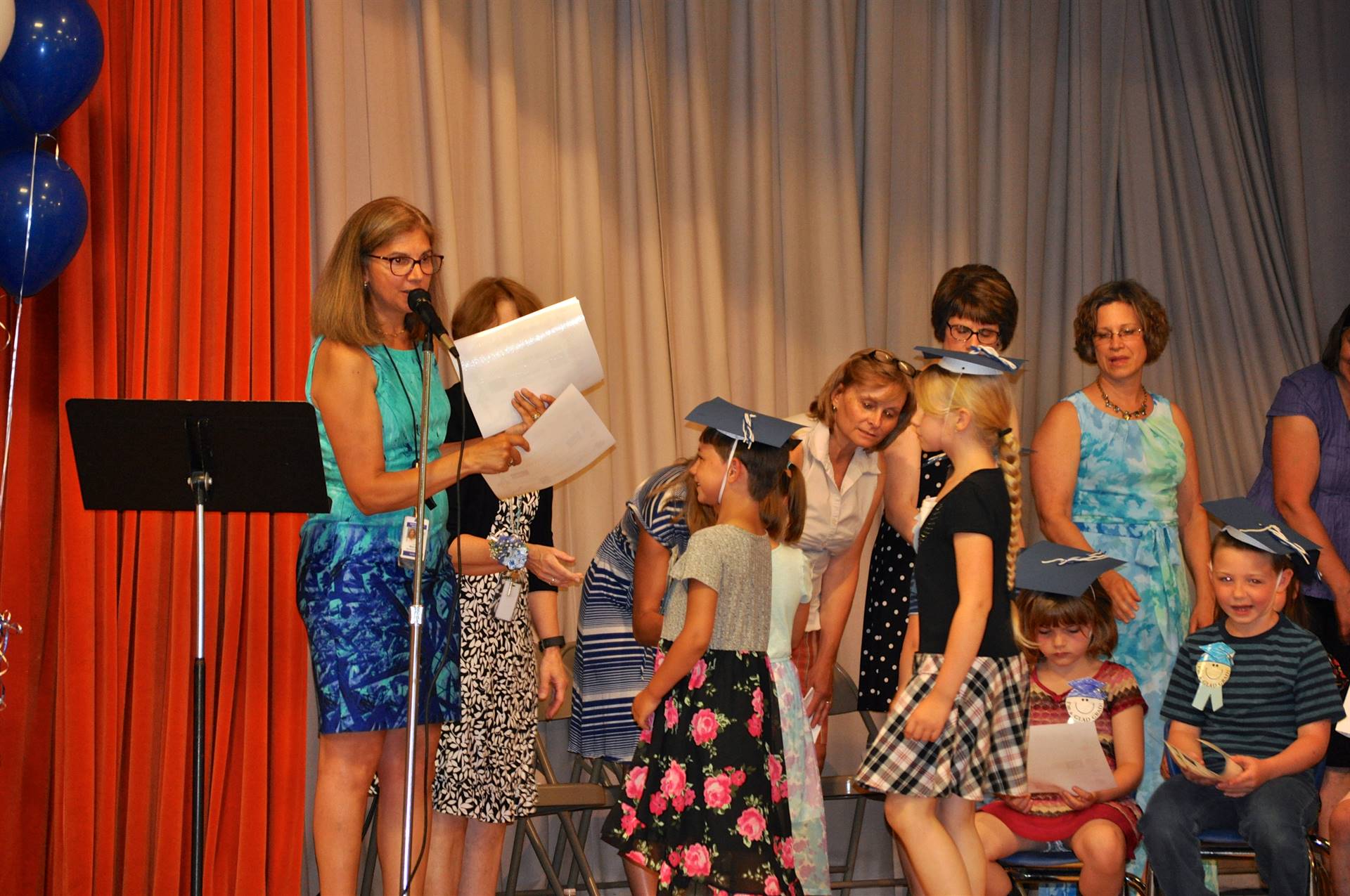 First graders receive their certificates of graduation!