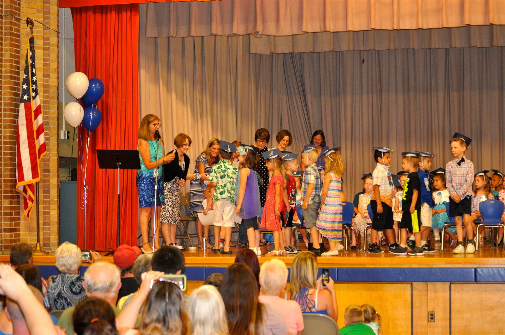 First graders receive their certificates of graduation!