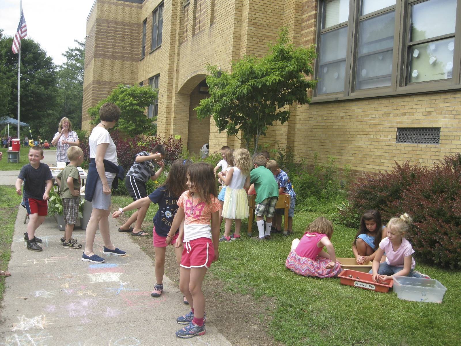 teachers and students dancing at the paint station.