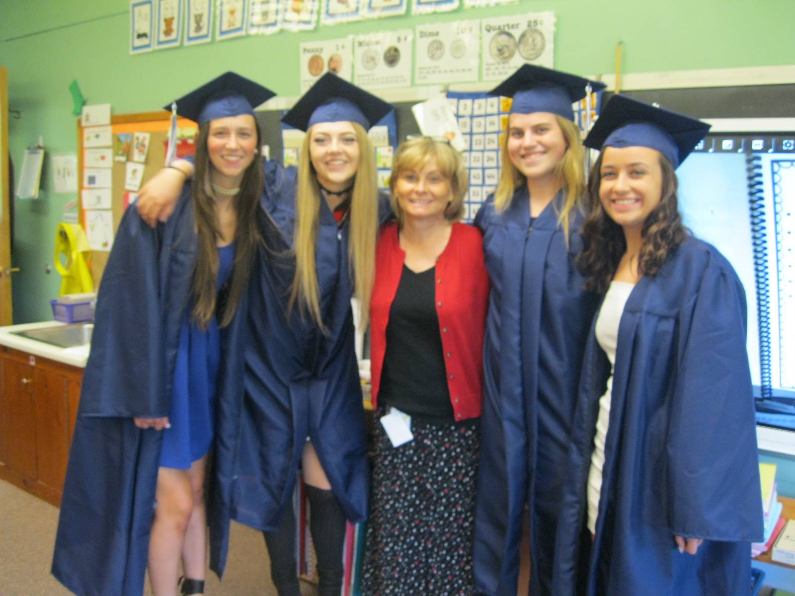 students and teachers pose.