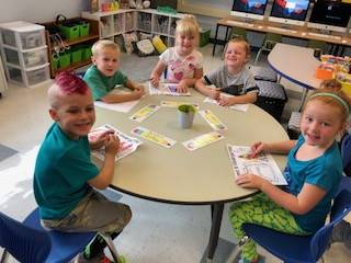 Students at work at a table.