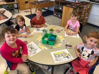 Kindergarteners show off coloring skills.