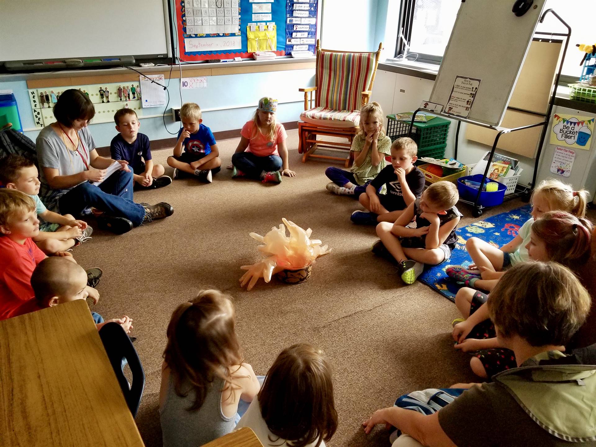 students sit in circle with the Counselors.