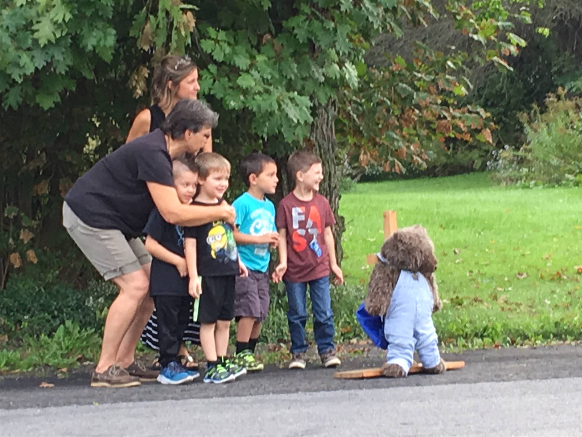 Bus driver shows students how to look for cross signal.