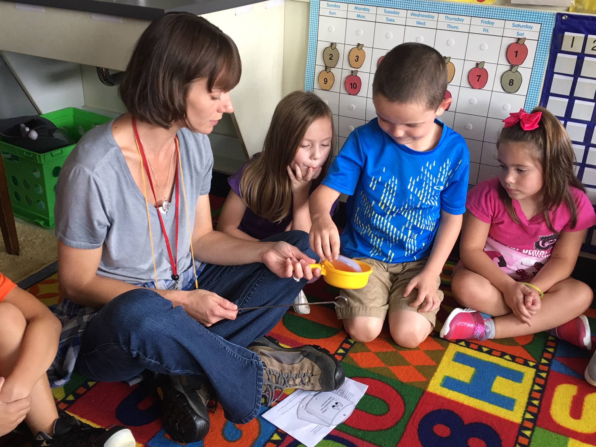 Student chooses marshmallow from Counselor.