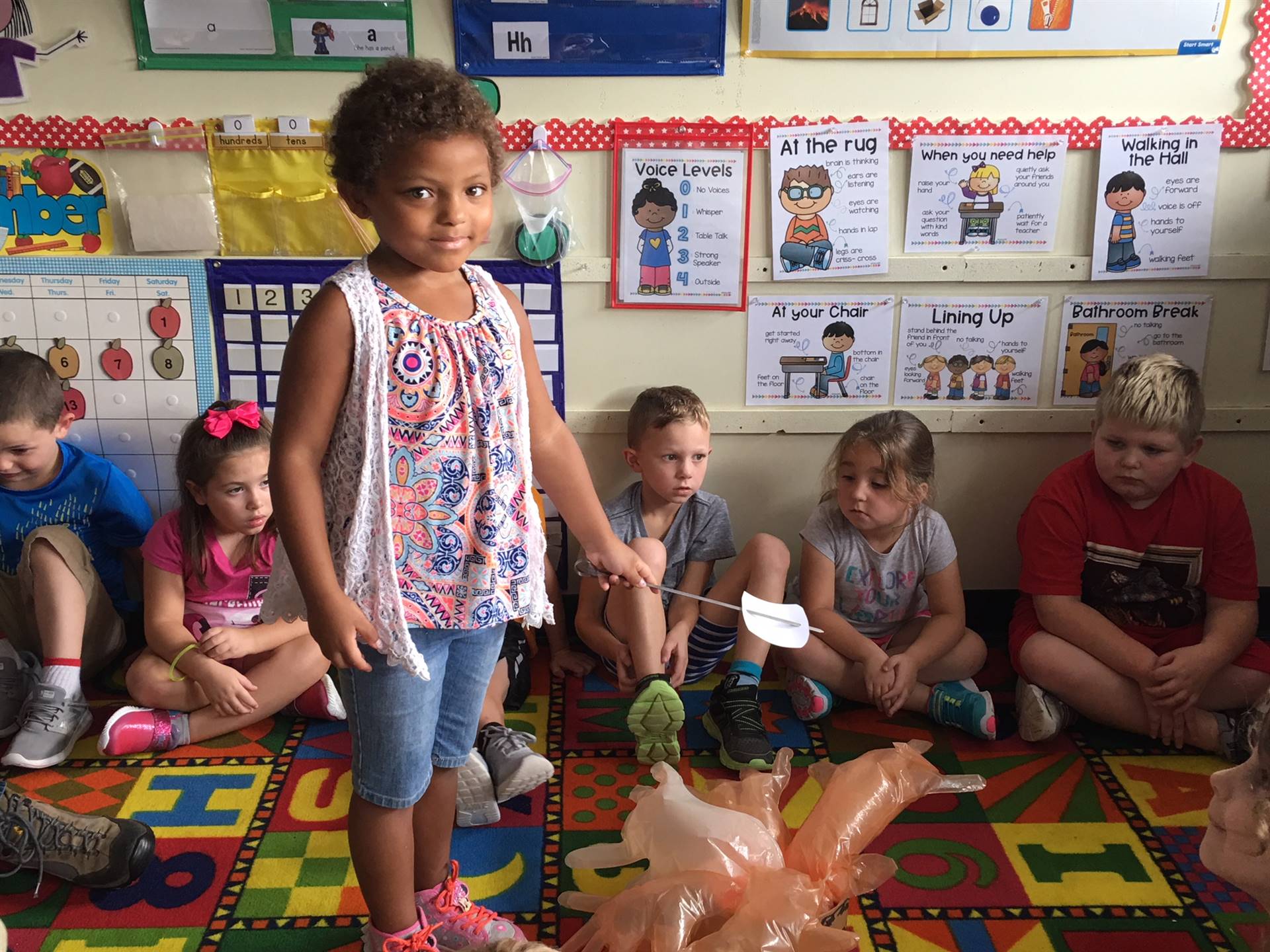 Students watch as a student responds to marshmallow question.