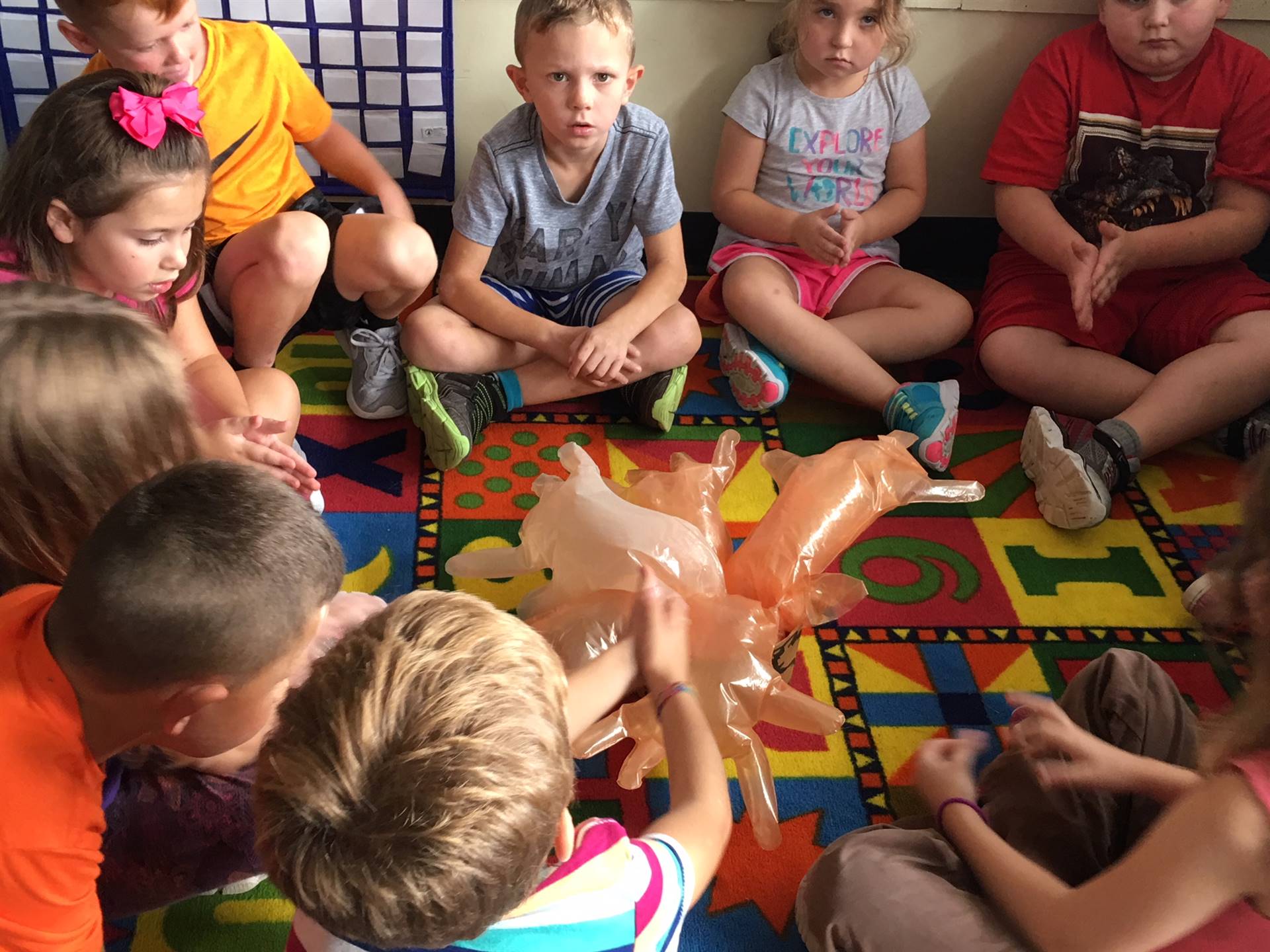 Students warm hands around campfire and learn about what counselors do.