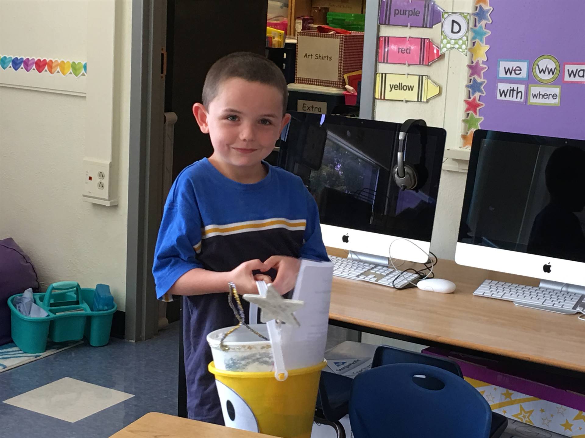 A student tries to lift a heavy bucket filled with sad feelings.