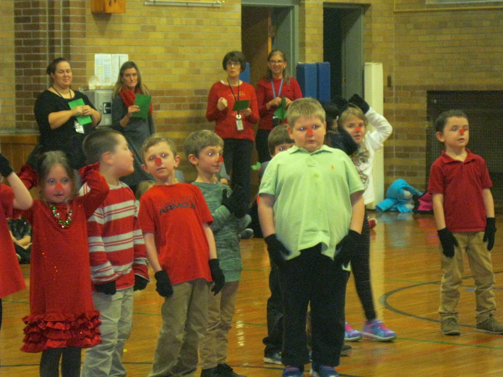 Several students show their rudolph noses. 