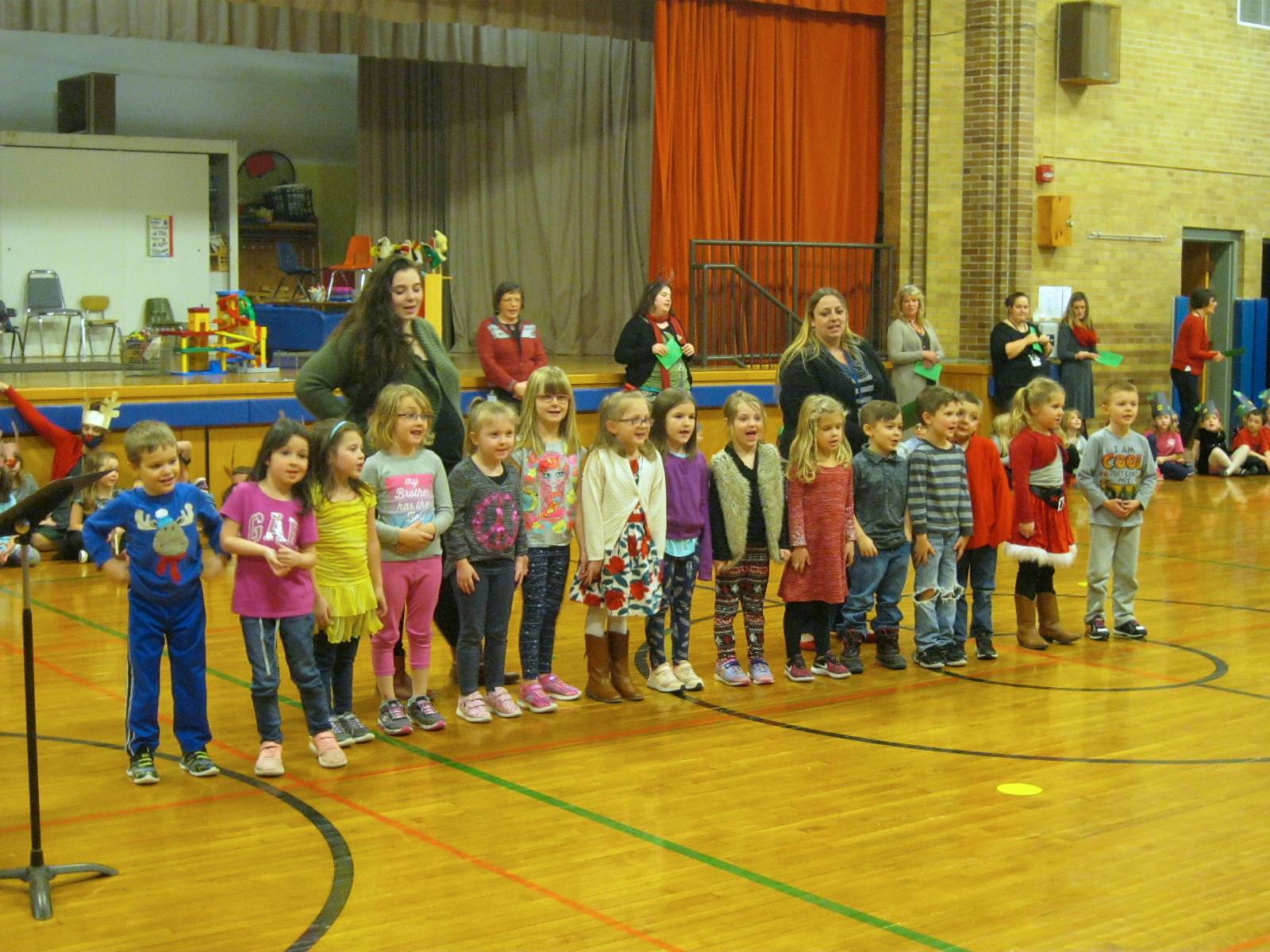 Student sing at holiday sing a long.