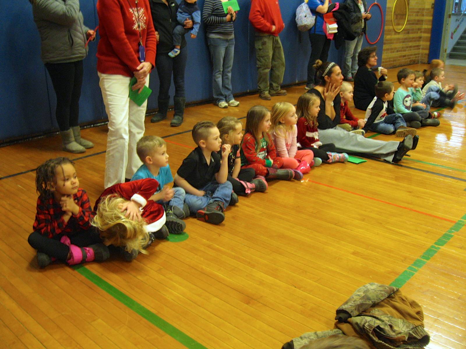Students watch and listen to songs.
