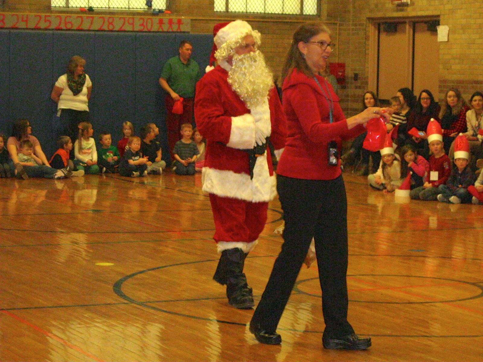 Santa and his helper at sing a long.