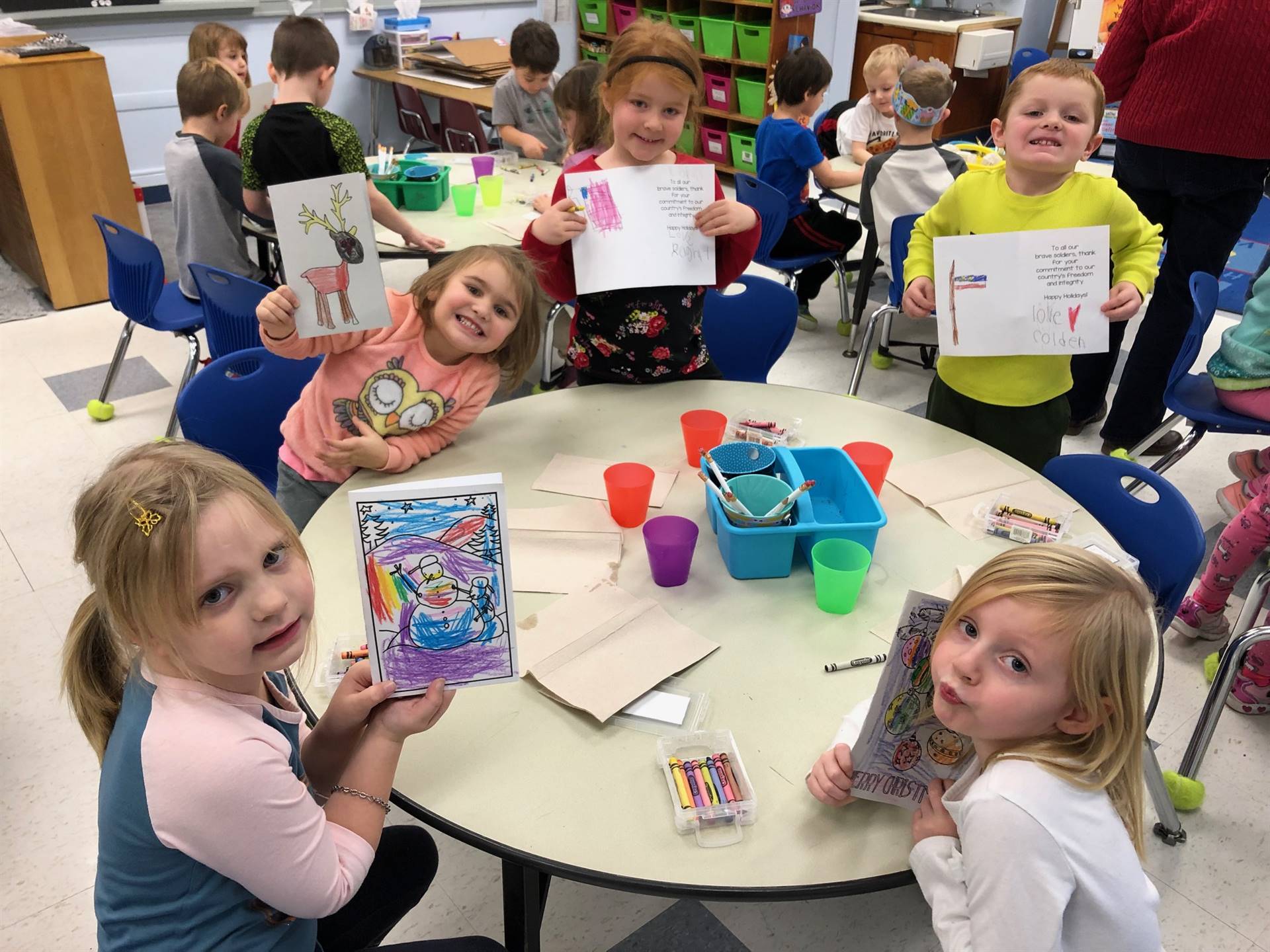 Students show off their coloring.