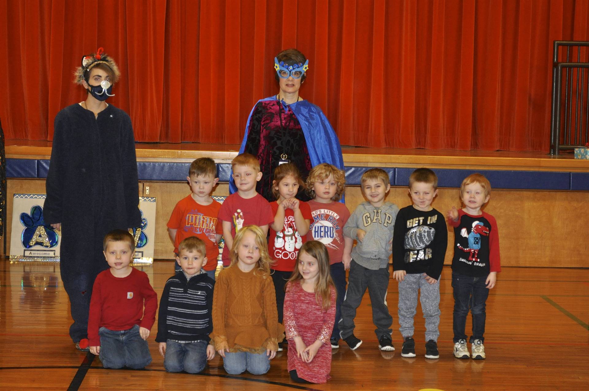 Super Hero Goal Getter, Bobkitten, and students celebrate reaching personal goals.