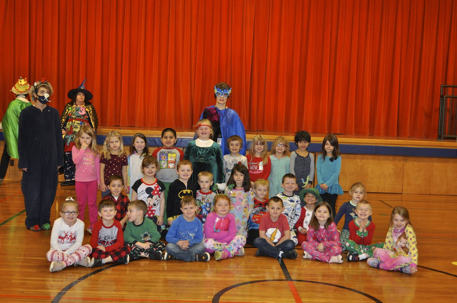 Super Hero Goal Getter, Bobkitten, and students celebrate reaching personal goals.