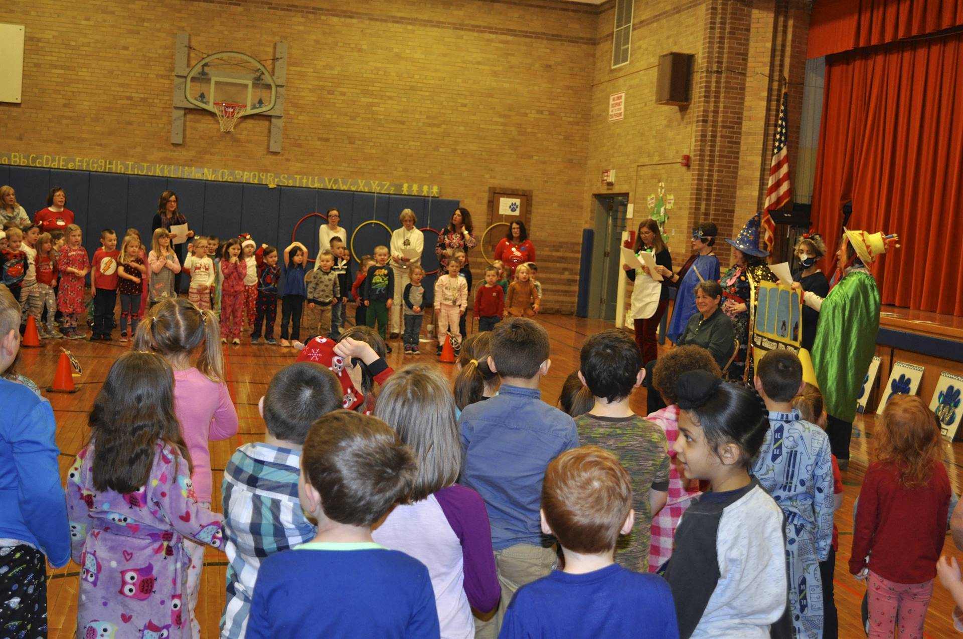 Students and staff sing "Wheels on the Bus" 