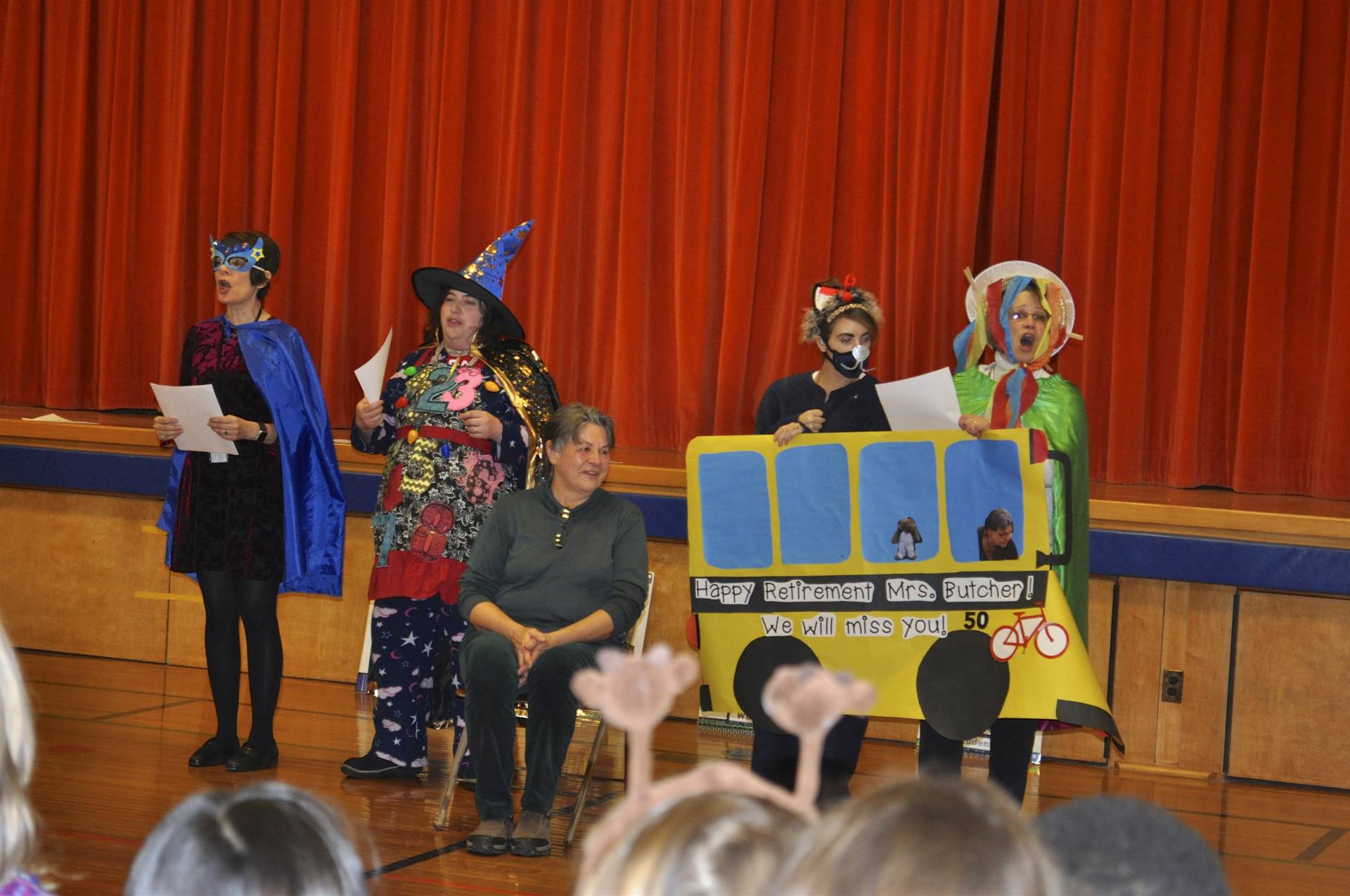 Staff sing wheels on the bus to retiring bus driver.