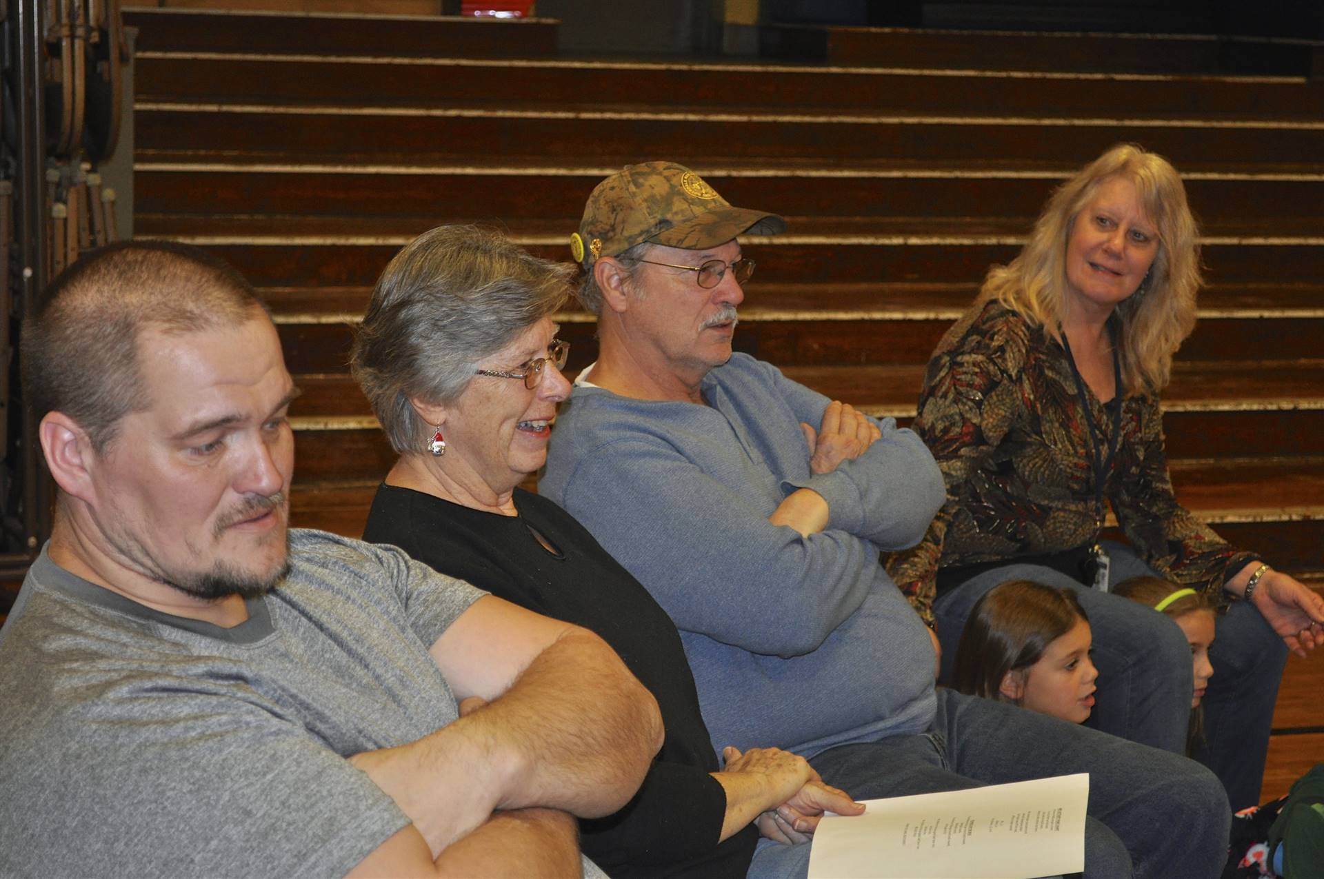 Mrs. Butcher's friends and family watch the assembly.