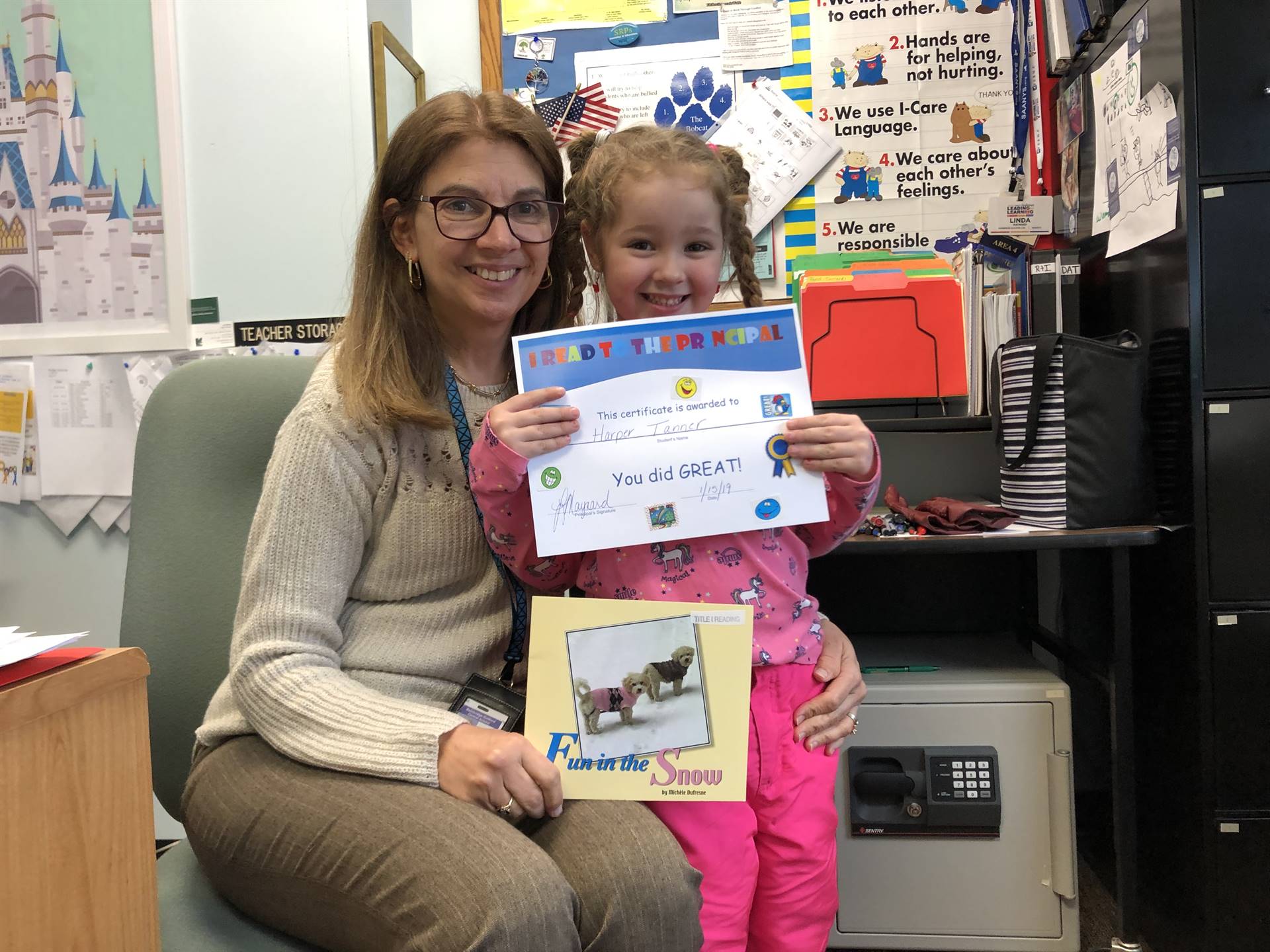 Principal with kindergarten reader.