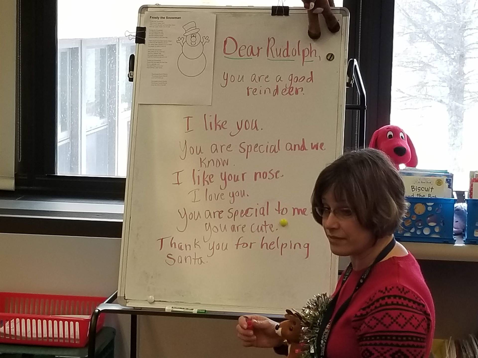 Counselor writes a "Dear Rudolph" list generated by students, 