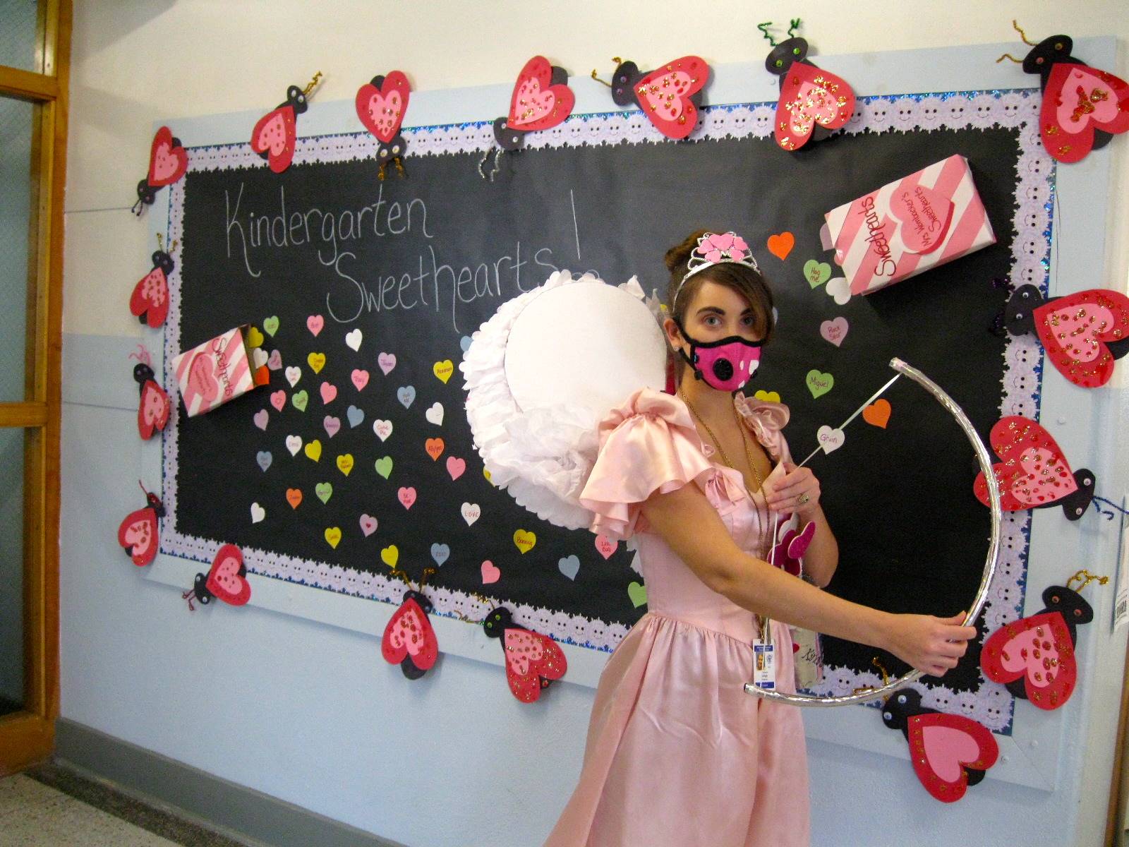 Teacher dressed as cupid with her magic cupid bow!
