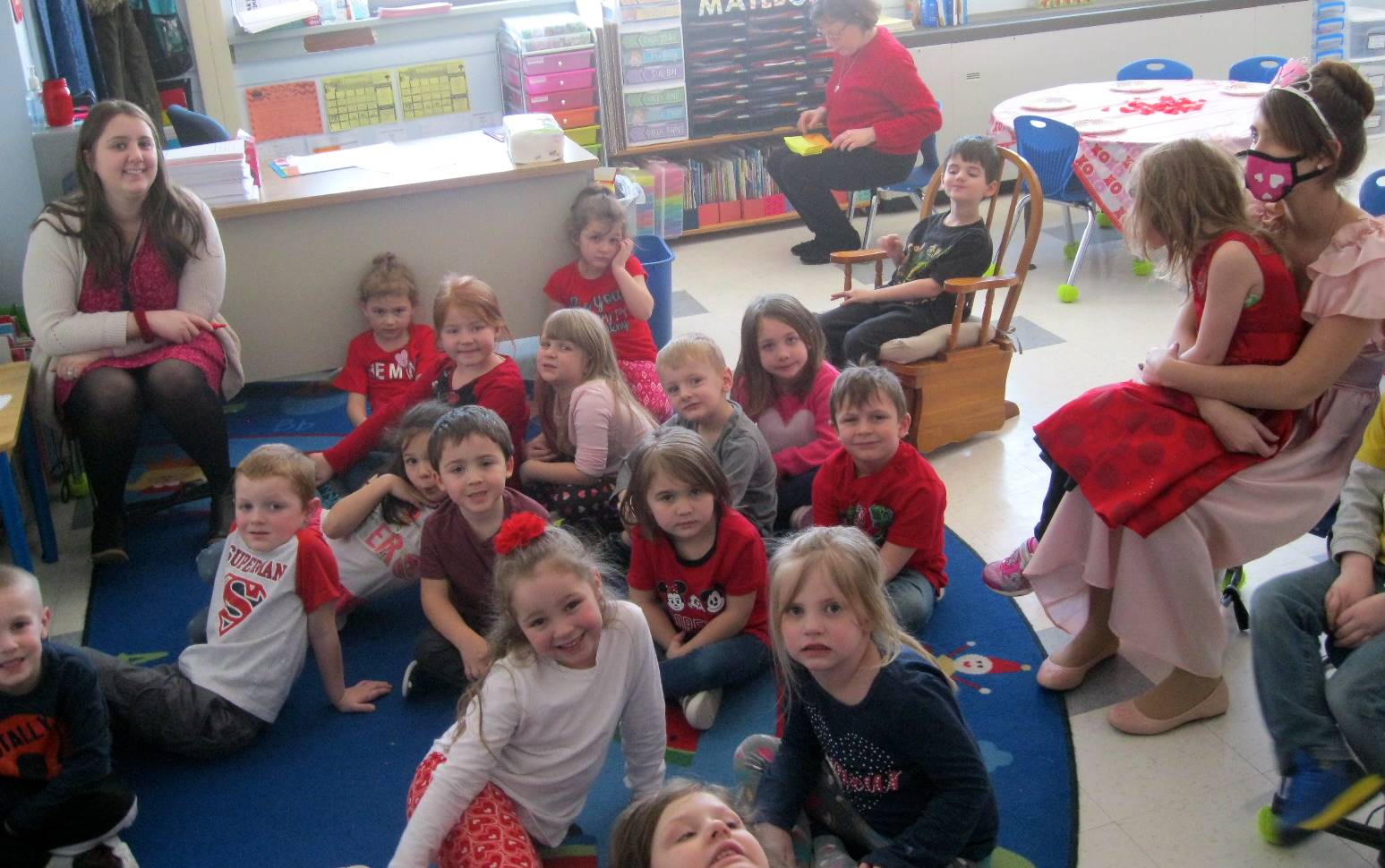 A teacher and cupid with students.