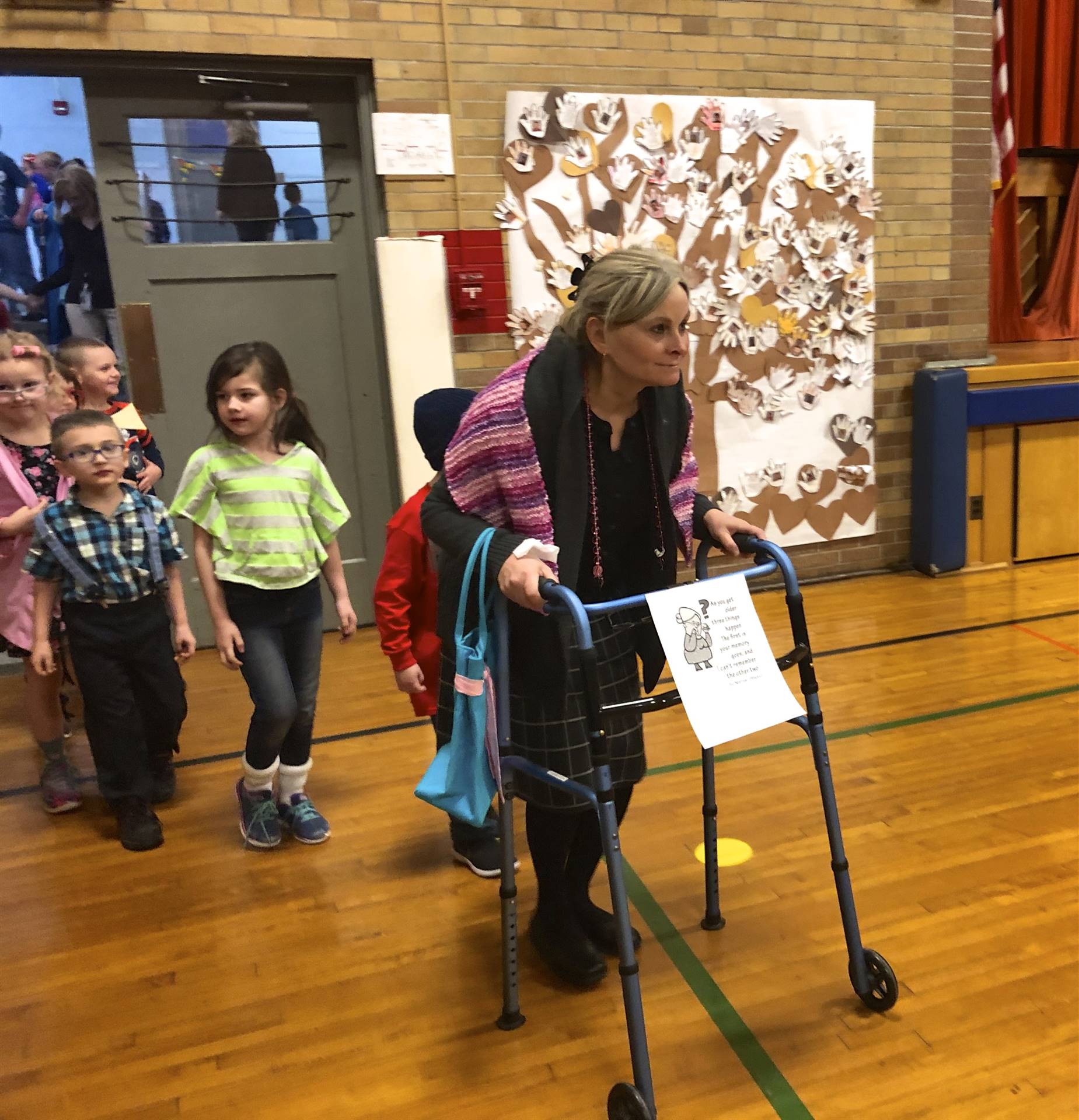 A teacher dressed up as a 100 year old lady.